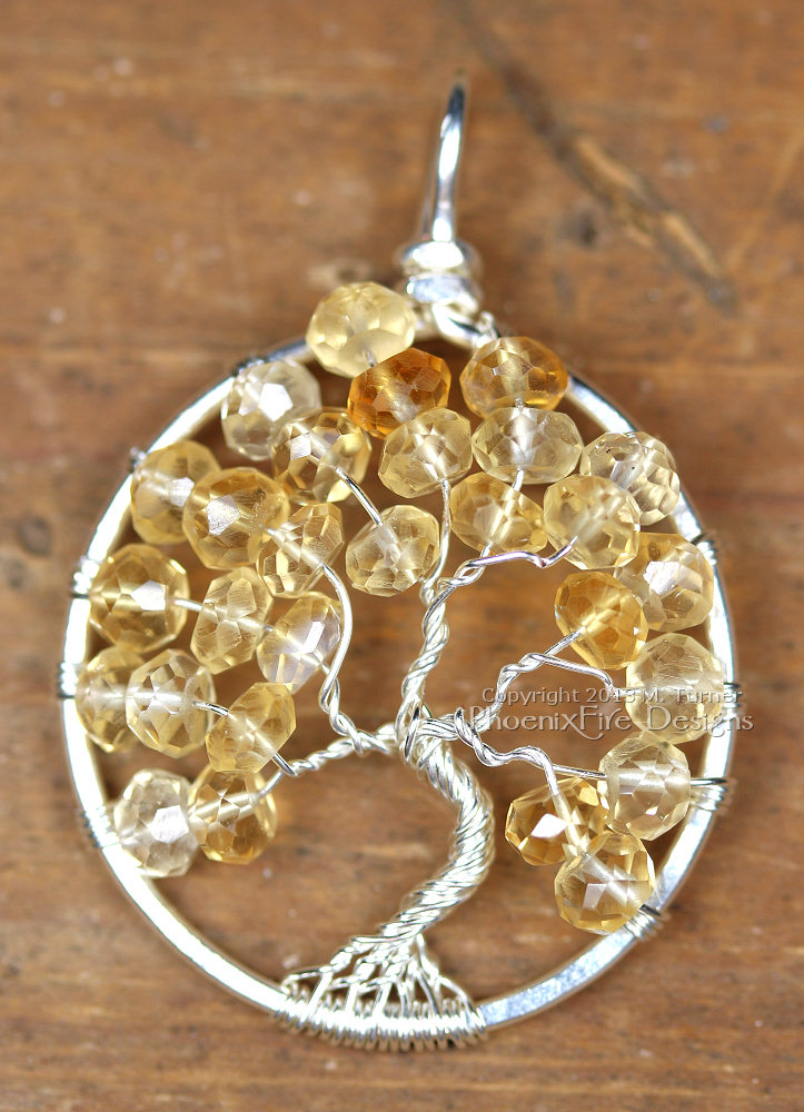 Soft, pale shaded yellow faceted citrine rondelle gemstones are the centerpiece of this Tree of Life pendant handmade wire wrapped in silver wire. Birthstone of November.