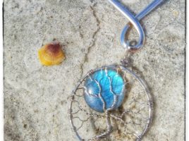 Handmade, blue flash labradorite full moon wire wrapped tree of life pendant by PhoenixFire Designs fits in nicely with the beaches of Clearwater St. Petersburg, Florida. Order yours from the PhoenixFire Designs etsy shop.